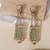 Gold plated mint green kundan stone dangler earrings