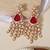 Gold plated red stone kundan long earrings