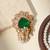 Gold plated green stone royal brooch