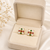 Certified natural freshwater pearls jewellery floral stud earrings with pearl, ruby & emerald stones gold-toned setting.