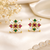 Certified natural freshwater pearls jewellery floral stud earrings with pearl, ruby & emerald stones gold-toned setting.