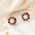Certified natural freshwater pearls jewellery pearl centre multicolour stone floral stud earrings gold-tone setting.