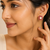 Certified natural freshwater pearls jewellery pearl centre ruby zirconia flower stud earrings, gold tone floral design.