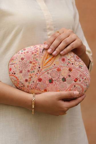 Pink printed oval clutch bag for women