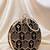 Black multipattern thread embroidery round clutch