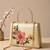 Printed ivory blossom clutch with hand embroidery