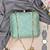 Mint green embroidered clutch bag for women