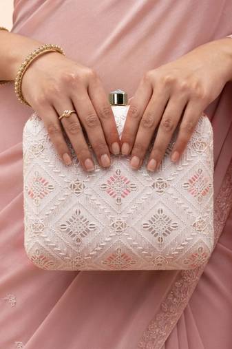  white based threadwork pattern embroidery clutch