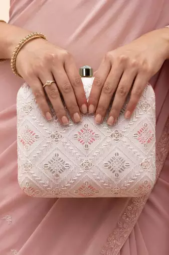  white based threadwork pattern embroidery clutch