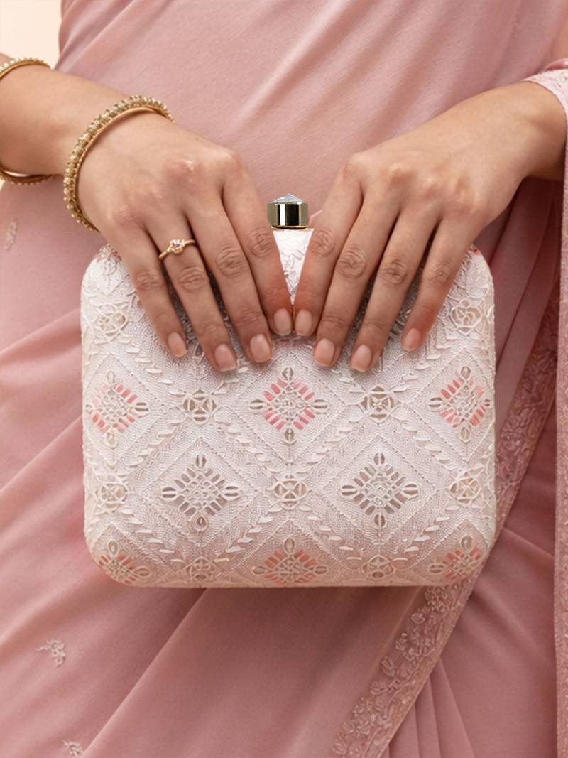  white based threadwork pattern embroidery clutch