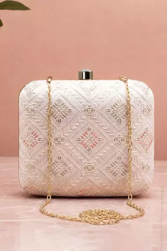  white based threadwork pattern embroidery clutch