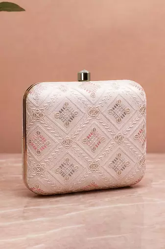  white based threadwork pattern embroidery clutch