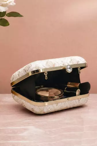  white based threadwork pattern embroidery clutch