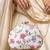  white based pink and grey threadwork embroidery clutch