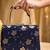   black based silver floral printed brocade fabric clutch bag for women with detachble strap