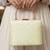  pista green based threadwork pattern embroidery clutch
