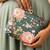  olive green based pink floral printed clutch