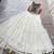 women embroidered off white tiered lehenga set with bandhani mirror work blouse for garba & navratri - free size