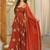 Rust orange embroidered flared anarkali gown with dupatta