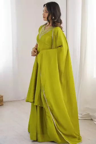 Women green silk embroidery work detailing kurta set with dupatta