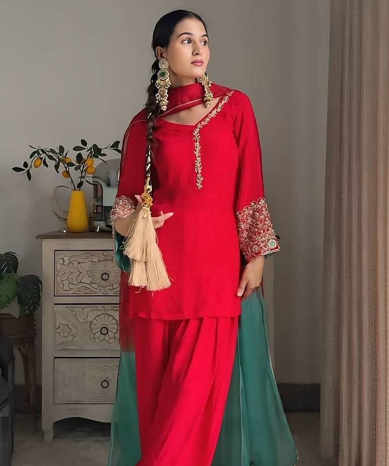 Women red silk embroidery work detailing kurta set with dupatta
