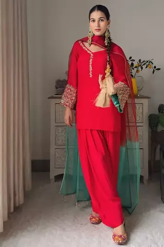 Women red silk embroidery work detailing kurta set with dupatta