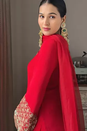 Women red silk embroidery work detailing kurta set with dupatta