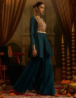 Teal blue mul cotton set with a long-sleeve flared peplum top, mirror-work embroidered yoke. 2