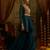 Teal blue mul cotton set with a long-sleeve flared peplum top, mirror-work embroidered yoke.