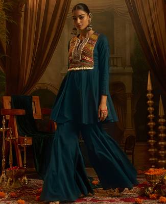Teal blue mul cotton set with a long-sleeve flared peplum top, mirror-work embroidered yoke. 3