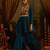 Teal blue mul cotton set with a long-sleeve flared peplum top, mirror-work embroidered yoke.