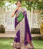Women's purple jacquard silk blend saree with zari floral border festive