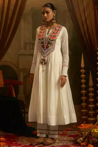 White mul cotton anarkali set featuring intricate multicolour hand embroidery.