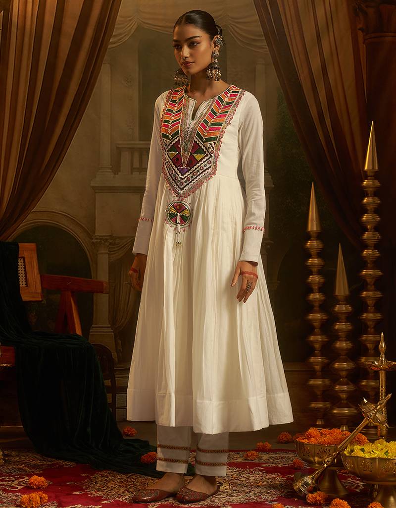 White mul cotton anarkali set featuring intricate multicolour hand embroidery.