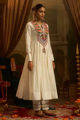 White mul cotton anarkali set featuring intricate multicolour hand embroidery.