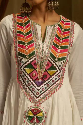 White mul cotton anarkali set featuring intricate multicolour hand embroidery.