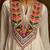 White mul cotton anarkali set featuring intricate multicolour hand embroidery.