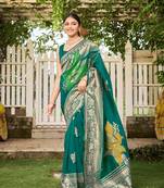 Women's teal green jacquard silk blend saree with zari floral border wear