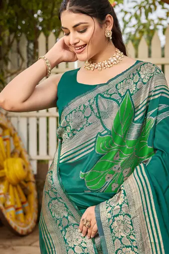 Women's teal green jacquard silk blend saree with zari floral border wear