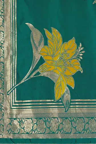 Women's teal green jacquard silk blend saree with zari floral border wear