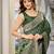 women's green jacquard silk blend saree with zari paisley border occasion wear