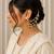Gold plated pearl chain ear cuff with multi-layer pearl dangler design
