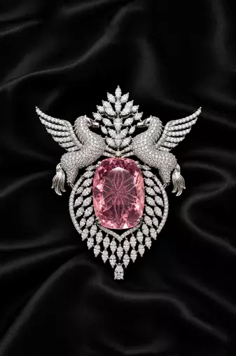 Elegant silver-tone swan brooch with large pink crystal & clear stone embellishment