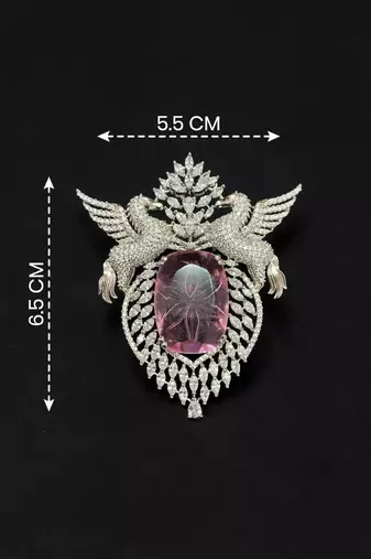 Elegant silver-tone swan brooch with large pink crystal & clear stone embellishment
