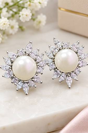 Elegant pearl and crystal floral stud earrings with silver-tone finish