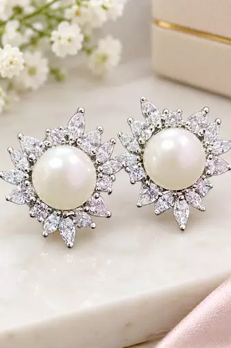 Elegant pearl and crystal floral stud earrings with silver-tone finish