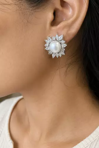 Elegant pearl and crystal floral stud earrings with silver-tone finish