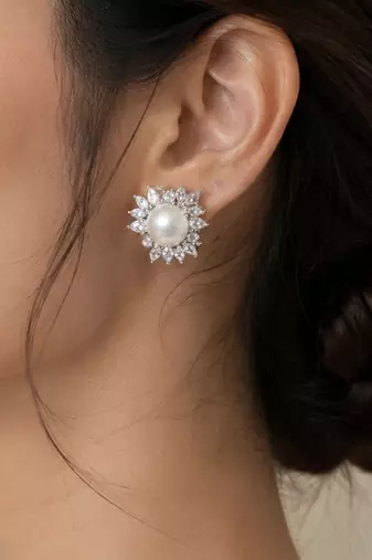 Elegant pearl and crystal floral stud earrings with silver-tone finish