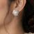 Elegant pearl and crystal floral stud earrings with silver-tone finish