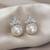 Elegant pearl & crystal floral stud earrings     silver tone statement jewellery